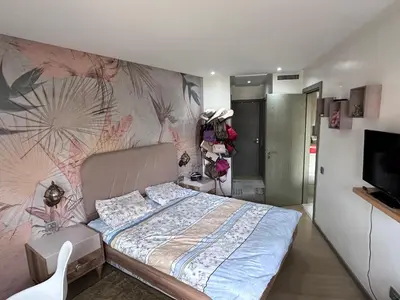 a bedroom with a bed and a wall mural at SUPERBE STUDIO MEUBLE CASABLANCA in Casablanca