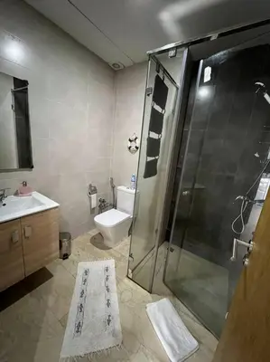 a bathroom with a shower and a toilet and a sink at BM Resort in Casablanca