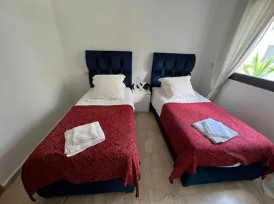 two beds sitting next to each other in a room at BM Resort in Casablanca