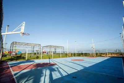 an empty basketball court with a basketball hoop at BM Resort in Casablanca
