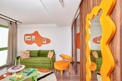 a living room with a couch and a table at Stayhere Casablanca - CFC - Vibrant Residence in Casablanca