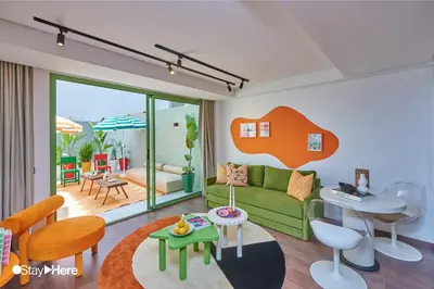 a living room with a couch and a table at Stayhere Casablanca - CFC - Vibrant Residence in Casablanca