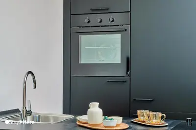 a kitchen with a sink and an oven at Stayhere Casablanca - CFC - Vibrant Residence in Casablanca