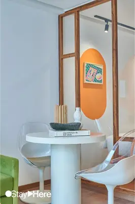 a dining room with a table and chairs at Stayhere Casablanca - CFC - Vibrant Residence in Casablanca