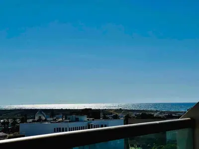 a view of the ocean from the balcony of a building at DreamParc - Vue sur Mer et Parc Securite 24H in Mohammedia