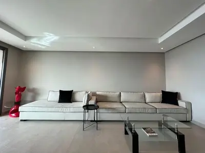 a living room with a couch and a table at Marina Love in Casablanca