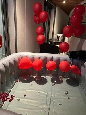 a bunch of red balloons on a table with blood at Marina Love in Casablanca
