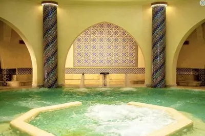 a large pool of water in a building with a mosque at Marina Love in Casablanca