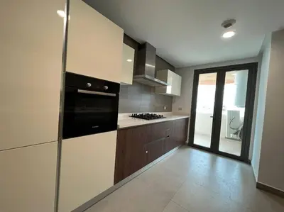 a kitchen with black and white appliances and a window at Marina Love in Casablanca