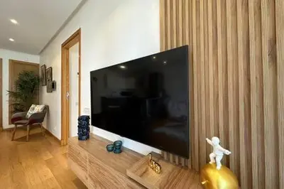 a living room with a large flat screen tv at Marvelous Ocean View Suite Marina - By AppartAli in Casablanca