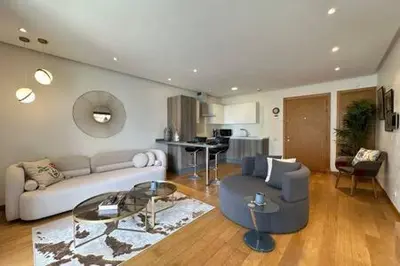 a living room with a couch and a table at Marvelous Ocean View Suite Marina - By AppartAli in Casablanca