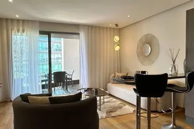 a living room with a couch and a table at Marvelous Ocean View Suite Marina - By AppartAli in Casablanca