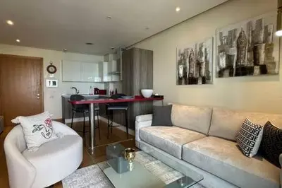 a living room with a couch and a table at Marina Urban Sea View - By AppartAli in Casablanca