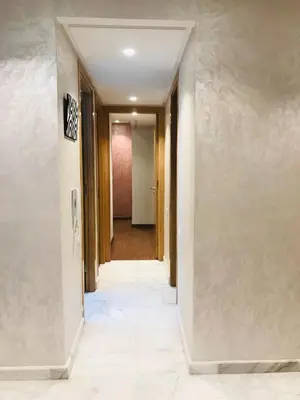 an empty hallway with a hallway leading into a room at THE luxurious and romantic pearl apartment in Mohammedia