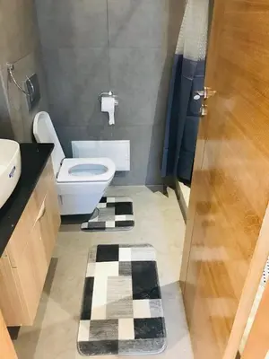 a bathroom with a toilet and a sink at THE luxurious and romantic pearl apartment in Mohammedia