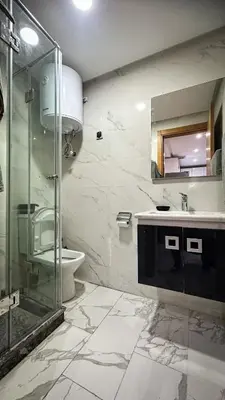 a bathroom with a shower and a sink and a toilet at Appartement BMK N-1 in Rabat