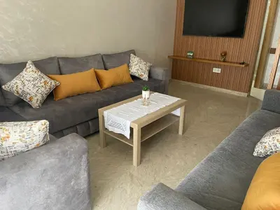 a living room with a couch and a coffee table at Studio meublé neuf à louer in Casablanca