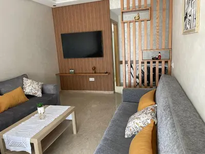 a living room with a couch and a table at Studio meublé neuf à louer in Casablanca