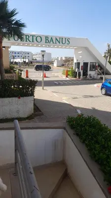 a shopping center with a sign that reads ricoco banos at Residence Puerto Banus in Mohammedia