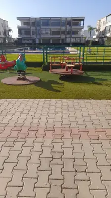 a park with a playground with a play area at Residence Puerto Banus in Mohammedia