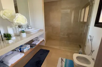 a bathroom with a toilet and a sink and a shower at Villa Jack Beach in Tamaris