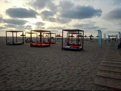 a group of play structures on a beach at CASA BAY BEACH OMK 2 in Sidi Rahal