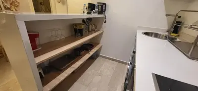 a small kitchen with a sink and a counter at Chez Joe - Location journalière Casablanca in Casablanca