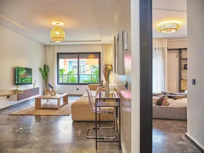 a living room with a couch and a bed at TheCasaEdition Gauthier Residency City Center in Casablanca