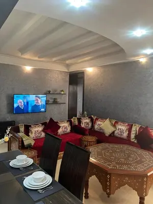 a living room with a couch and a table at Luxury apartments 3 in Casablanca