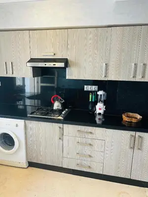 a kitchen with a stove and a microwave at Luxury apartments 3 in Casablanca
