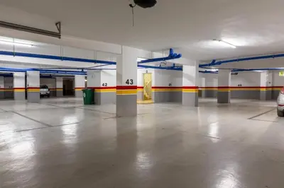 an empty parking garage with a car parked in it at Appartement - Dar Bouazza spacieux avec piscine à Dar Bouazza in Dar Bouazza