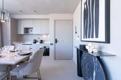 a kitchen and dining room with a table and chairs at TWENTY SIX ANFA LUXURY RESIDENCE by Shortstaymaroc -Hyper Centre -Parking in Casablanca