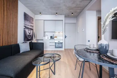 a living room with a couch and a table at TWENTY SIX ANFA LUXURY RESIDENCE by Shortstaymaroc -Hyper Centre -Parking in Casablanca