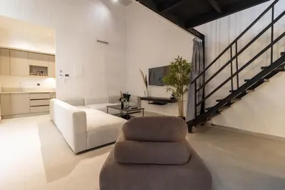 a living room with a couch and a chair at TWENTY SIX ANFA LUXURY RESIDENCE by Shortstaymaroc -Hyper Centre -Parking in Casablanca