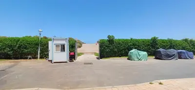 an empty gas station in a parking lot at Sidi Rahal Bleu Beach family in Sidi Rahal