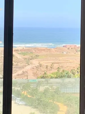 a view of the ocean from a hotel window at Zenata Tower in Casablanca