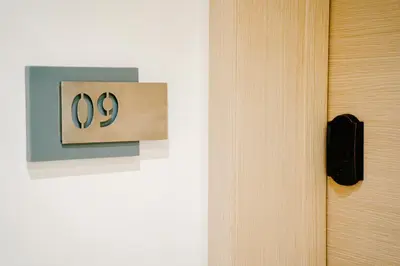 a sign with the number on a wall at Best location, 2 minute to beach in Casablanca