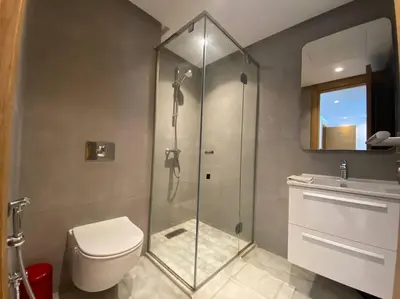 a bathroom with a shower and a toilet and a sink at Corniche Casablanca - Black New in Casablanca