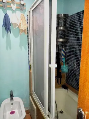 a bathroom with a shower and a toilet in it at Maison du bonheur in El Harhoura