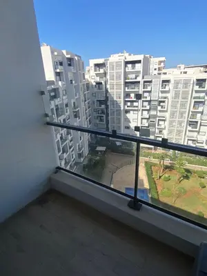 a balcony with a view of a large building at Prestigia Appartement Luxueux in Rabat