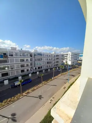 a view of a street with buildings in the background at Bel Appartement à Mansbay in Mansouria