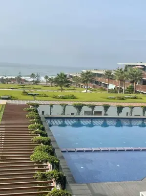 an overhead view of a swimming pool at a resort at Nice appartement pool & sea view in Dar Bouazza