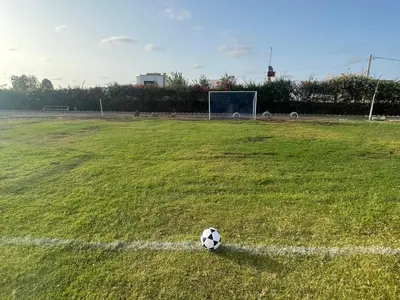 a soccer ball sitting on a soccer field at Villa avec piscine et jardin privés in Casablanca