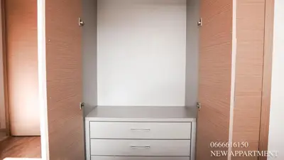 a room with a closet with a white drawer at New prestigia in Rabat