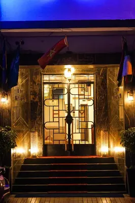 a front door of a restaurant at night at Hôtel Mauritania in Casablanca