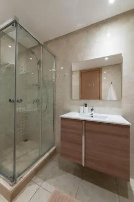 a bathroom with a shower and a sink at Très bel appartement bien situé Hayriad in Rabat