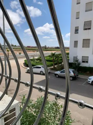 a view from a window of a parking lot at La location de la mer in Dar Bouazza