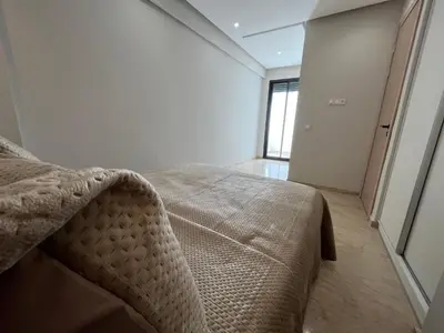 a bedroom with a bed in a room with a window at Comfy & Modern Studio at blv Anfa in Casablanca