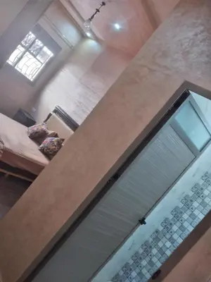 a room with a window and a glass door at Sweet Room Airport 5 in Deroua