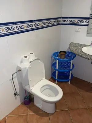a bathroom with a toilet and a sink at BOUZNIKA BAY COUNTRY CLUB in Bouznika